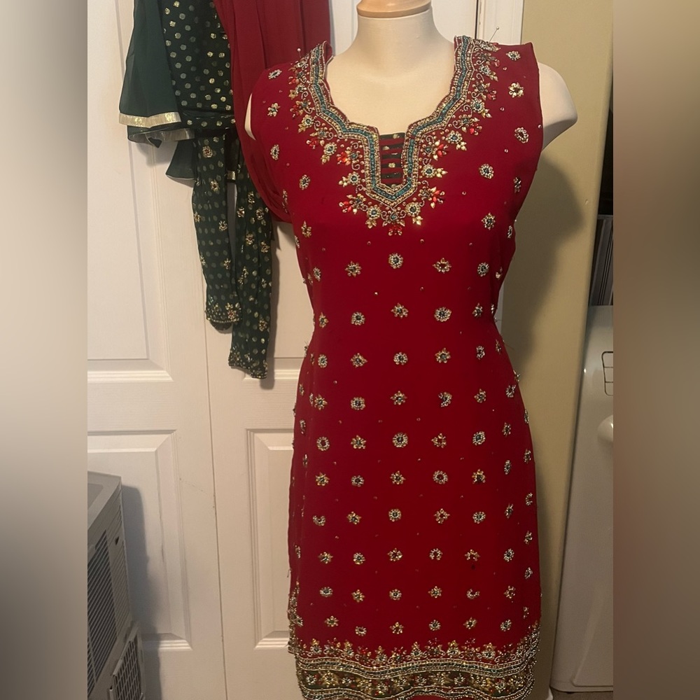 Red heavily detailed straight suit with pajami and dupatta